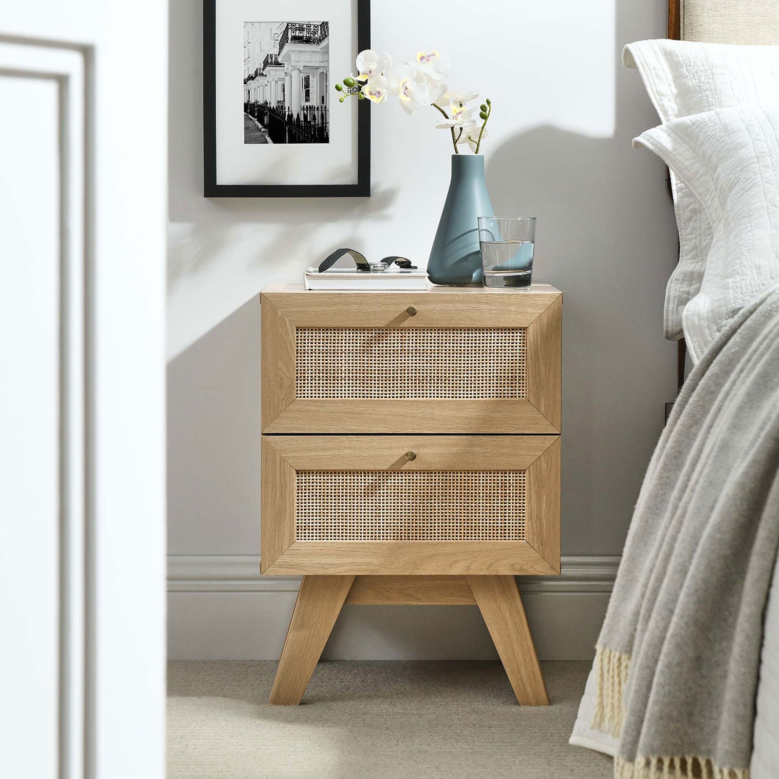 Soma nightstand styled beside the bed with decor accents for a warm, modern bedroom vignette. || MOD-7050-OAK || front_angle_room