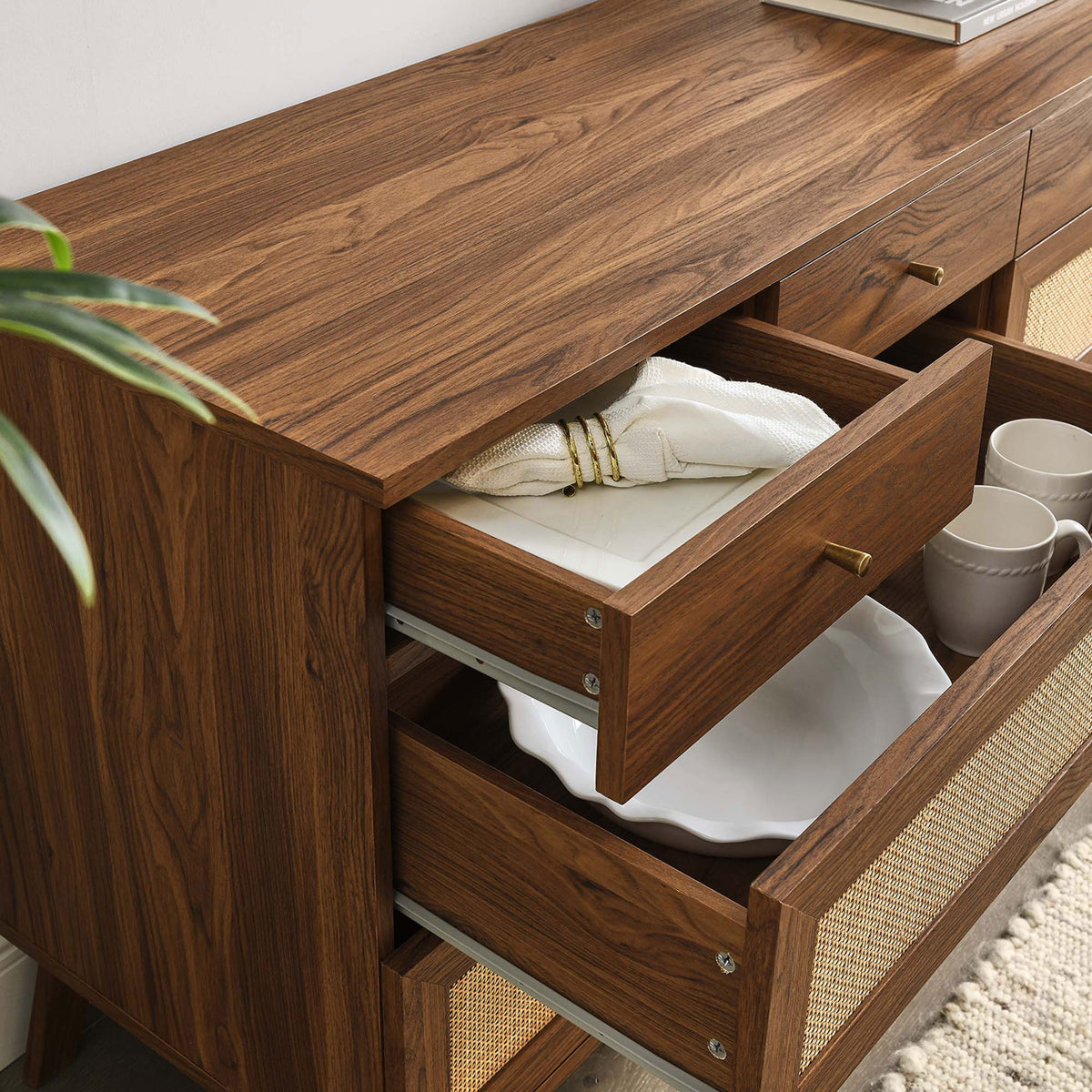 Styled drawers hold dinnerware and textiles, showing how the dresser keeps essentials organized and within reach || MOD-7054-WAL || storage_open_room