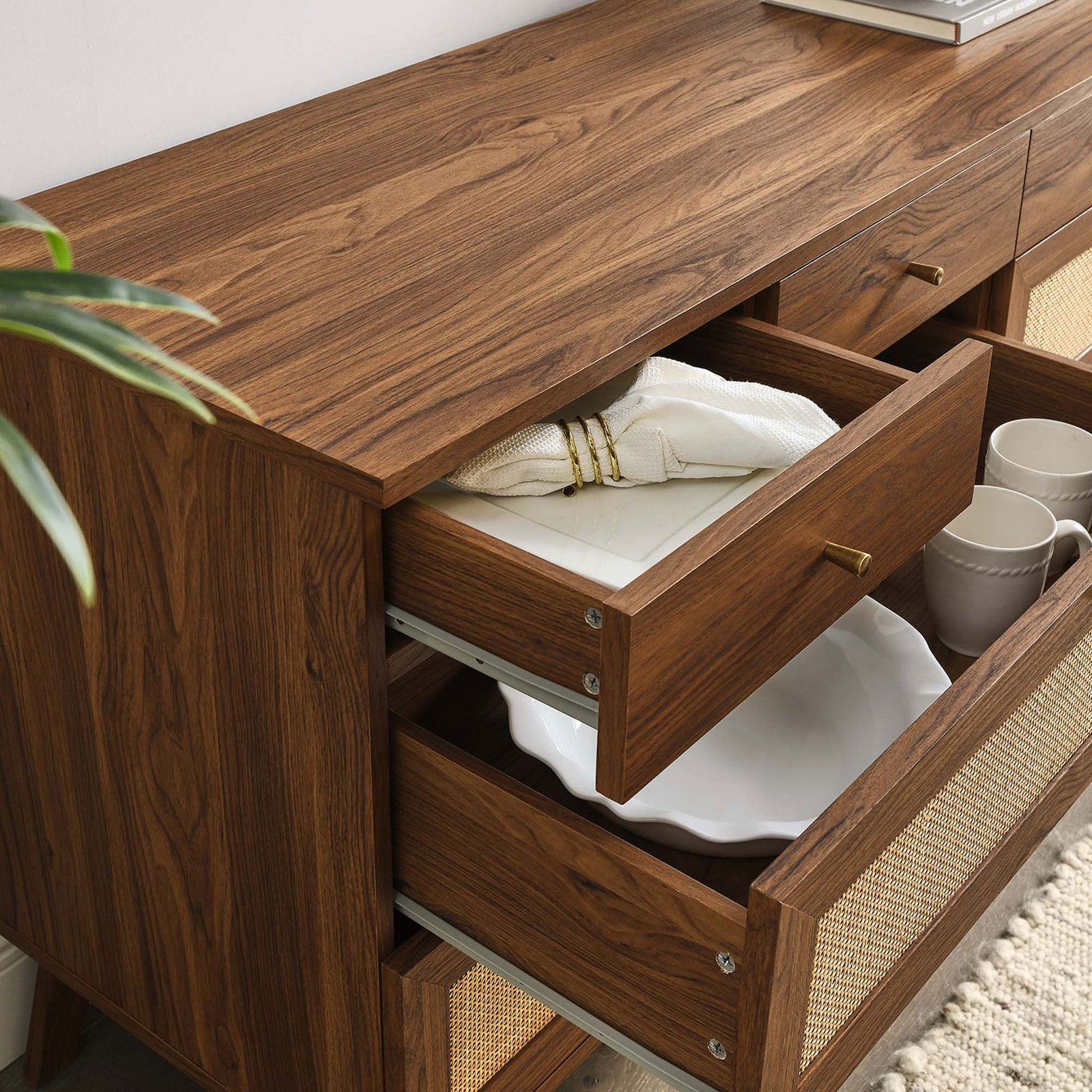 Styled drawers hold dinnerware and textiles, showing how the dresser keeps essentials organized and within reach || MOD-7054-WAL || storage_open_room
