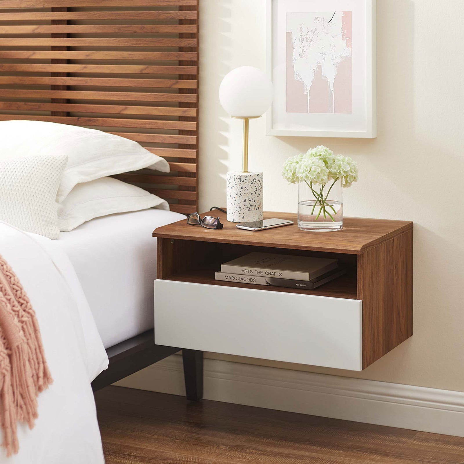 Modern walnut and white wall-mount nightstand beside a contemporary bed, topped with a lamp, vase, and essentials. || MOD-7057-WAL-WHI || front_angle_room