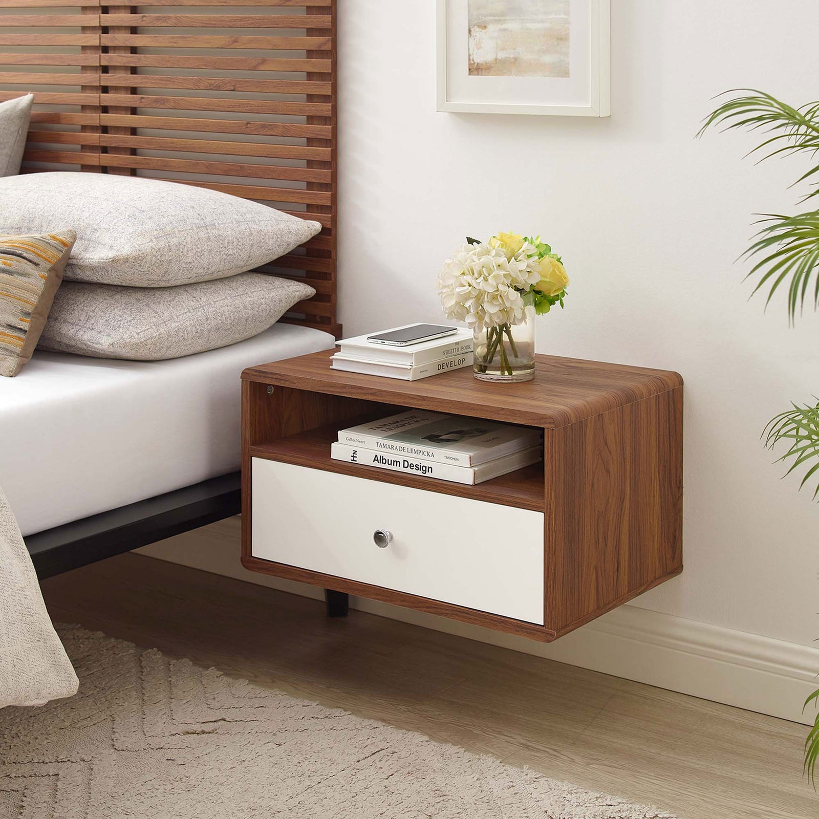 Wall-mounted nightstand styled beside a bed, topped with books and flowers in a bright bedroom || MOD-7059-WAL-WHI || front_angle_room