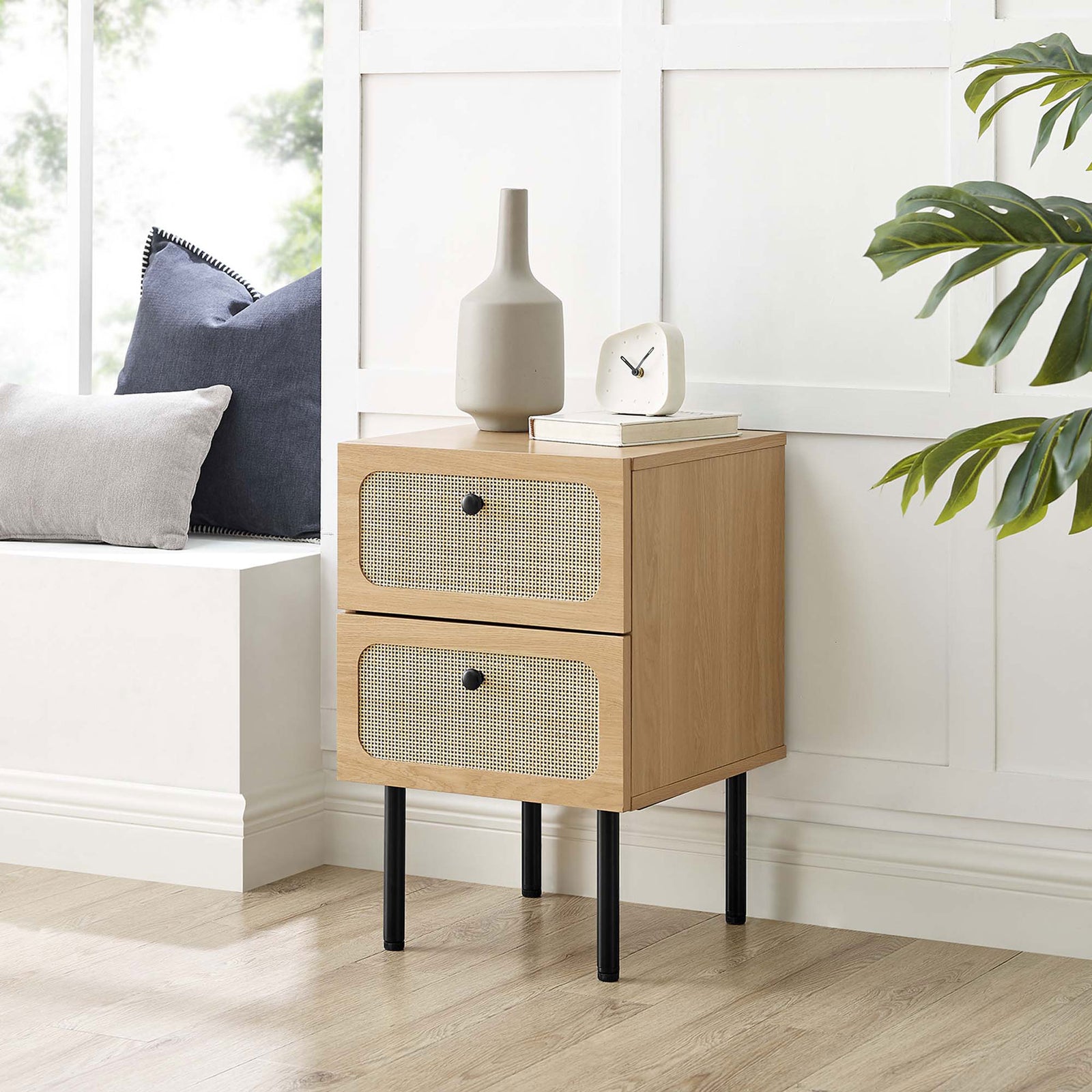 Oak and rattan nightstand styled beside a window seat with decor accents for a cozy bedroom look || MOD-7063-OAK || front_angle_room