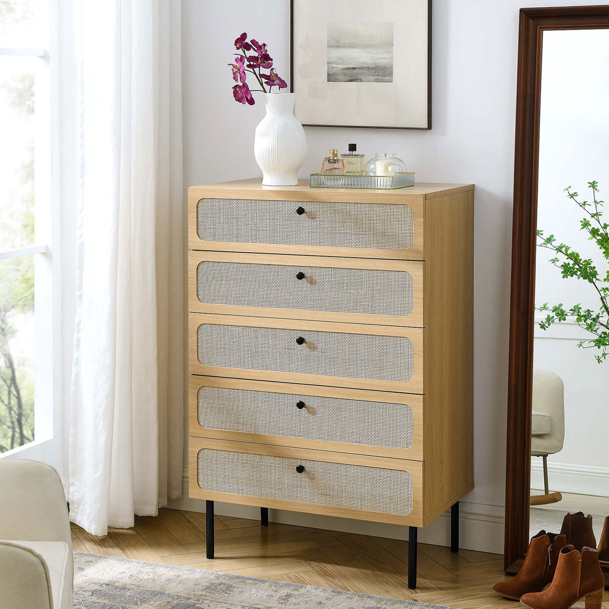 Oak rattan-front chest styled with decor and mirror in a modern bedroom corner || MOD-7065-OAK || front_angle_room