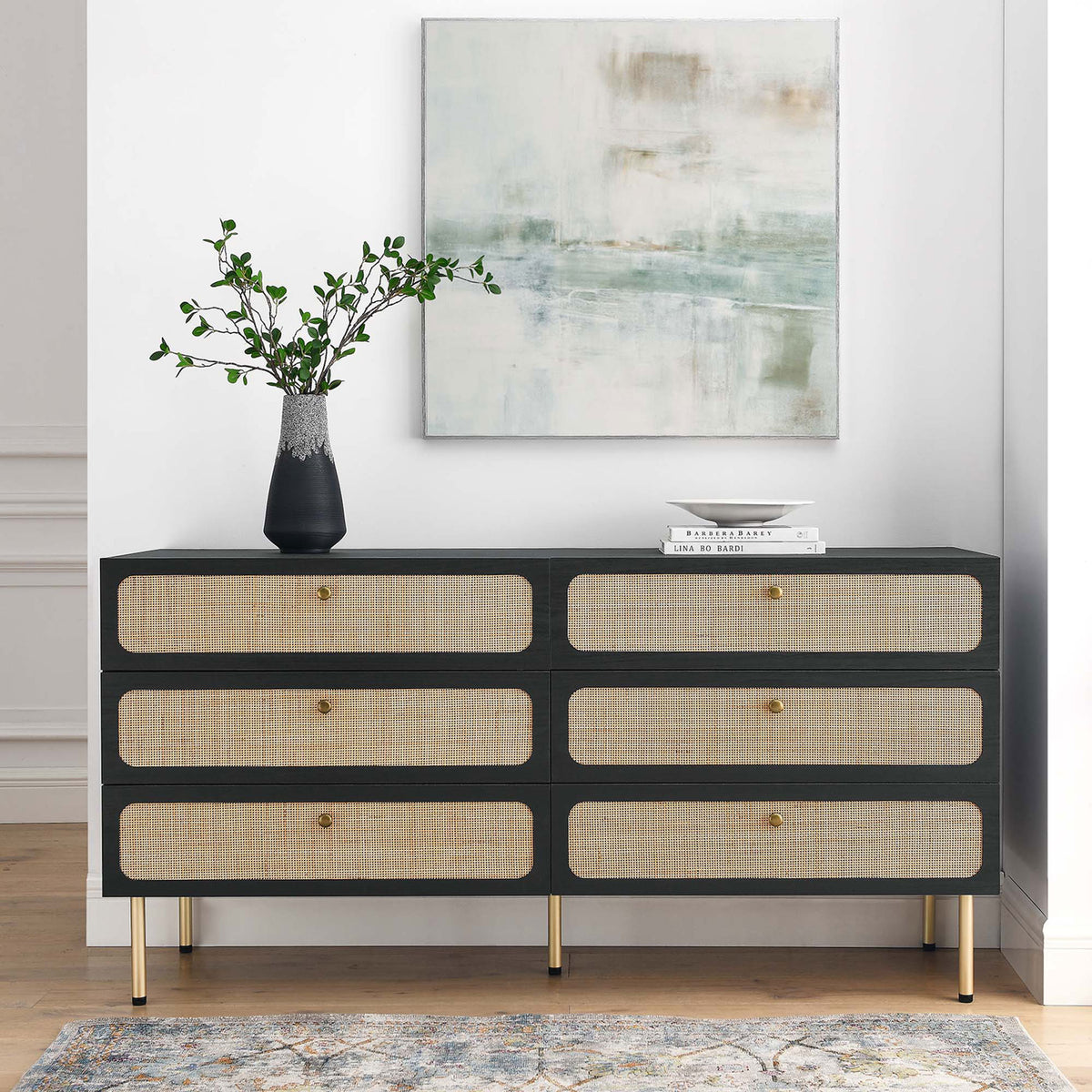 Black rattan-front dresser styled with decor accents, adding warm texture to a modern bedroom. || MOD-7067-BLK || front_angle_room
