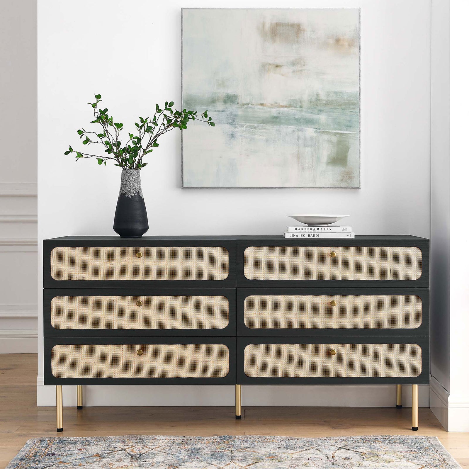 Black rattan-front dresser styled with decor accents, adding warm texture to a modern bedroom. || MOD-7067-BLK || front_angle_room