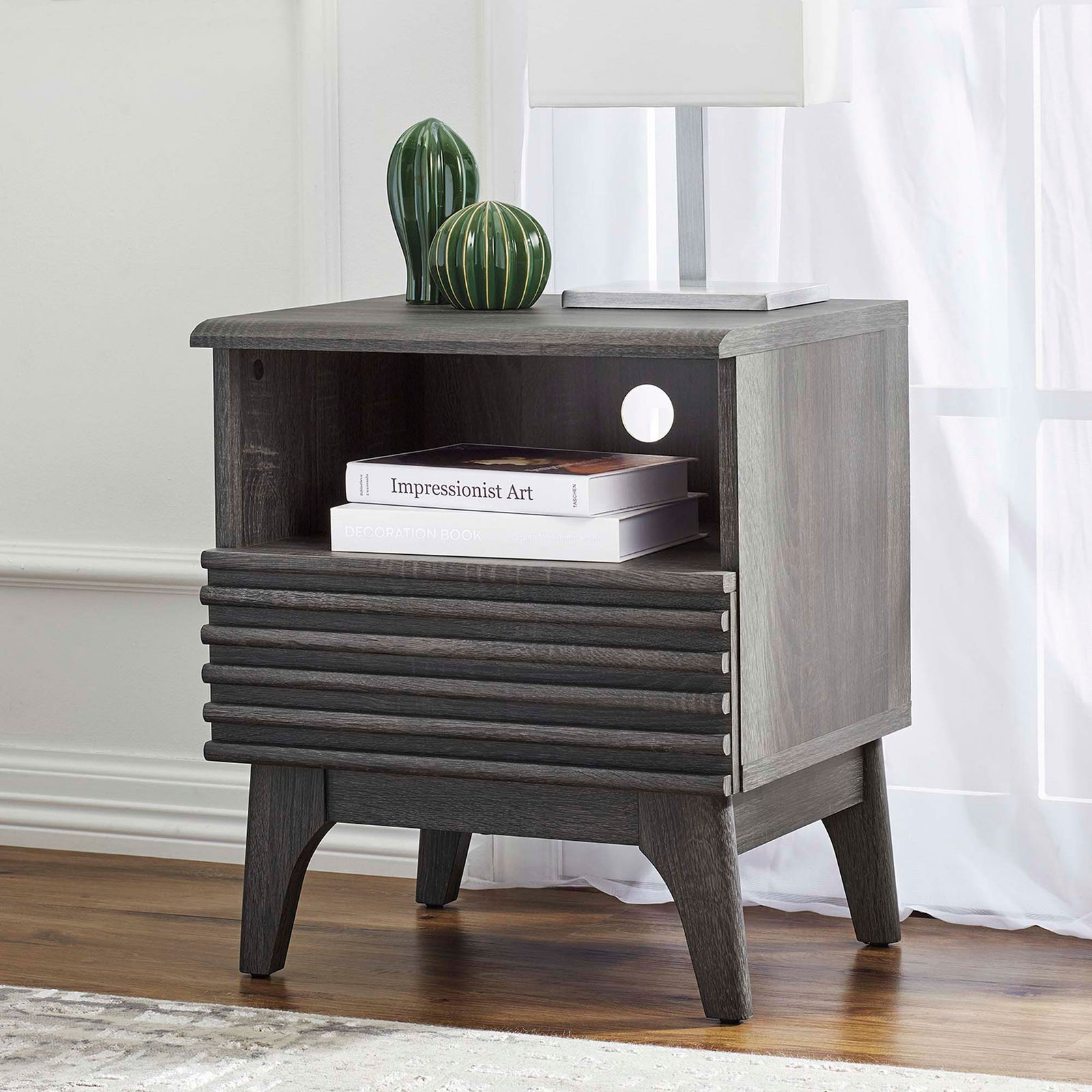 Styled charcoal nightstand beside window with books and decor on open shelf and louvered drawer || MOD-7070-CHA || front_angle_room