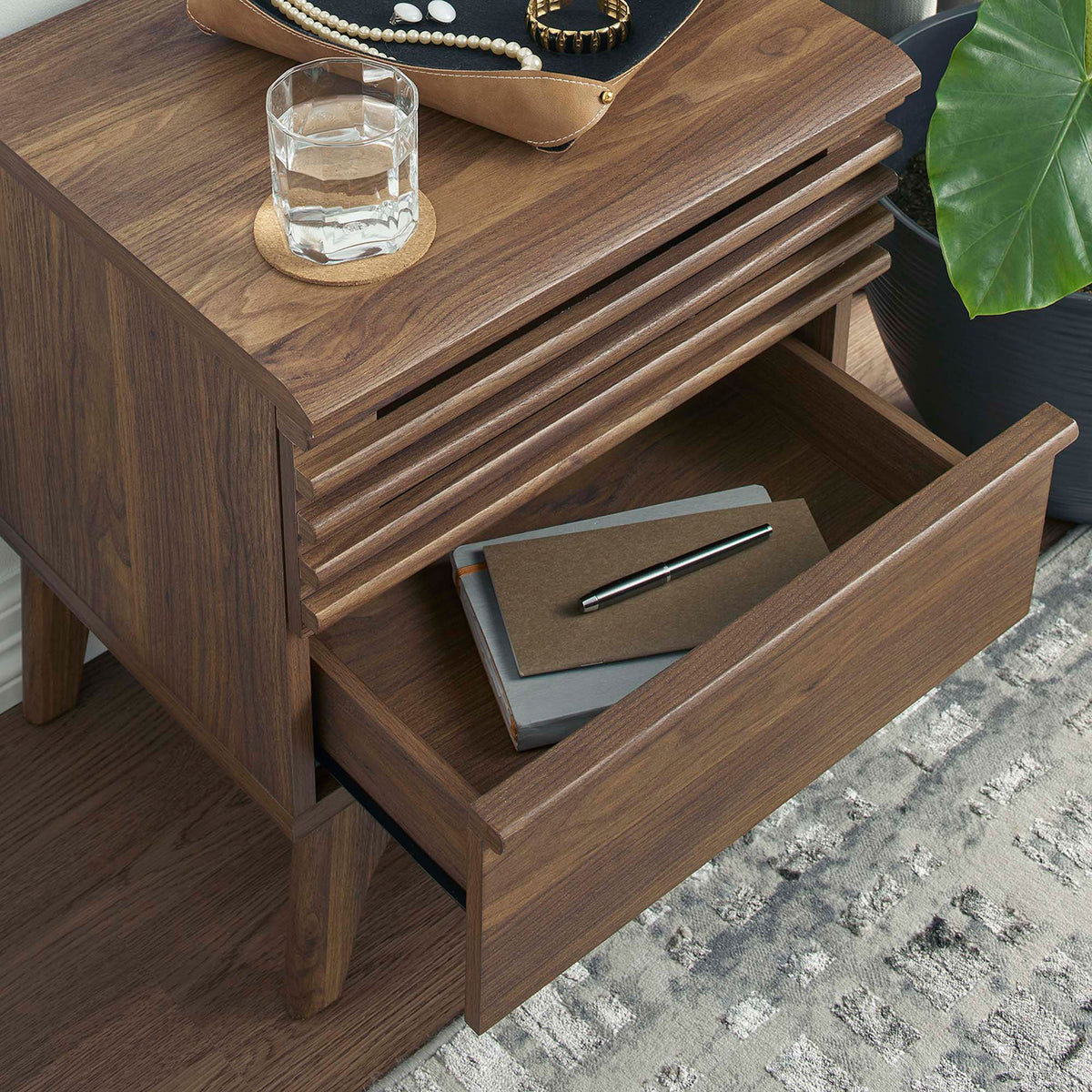 Walnut nightstand in a room scene with open drawer displaying bedside essentials and richly grained top || MOD-7071-WAL || storage_open_room