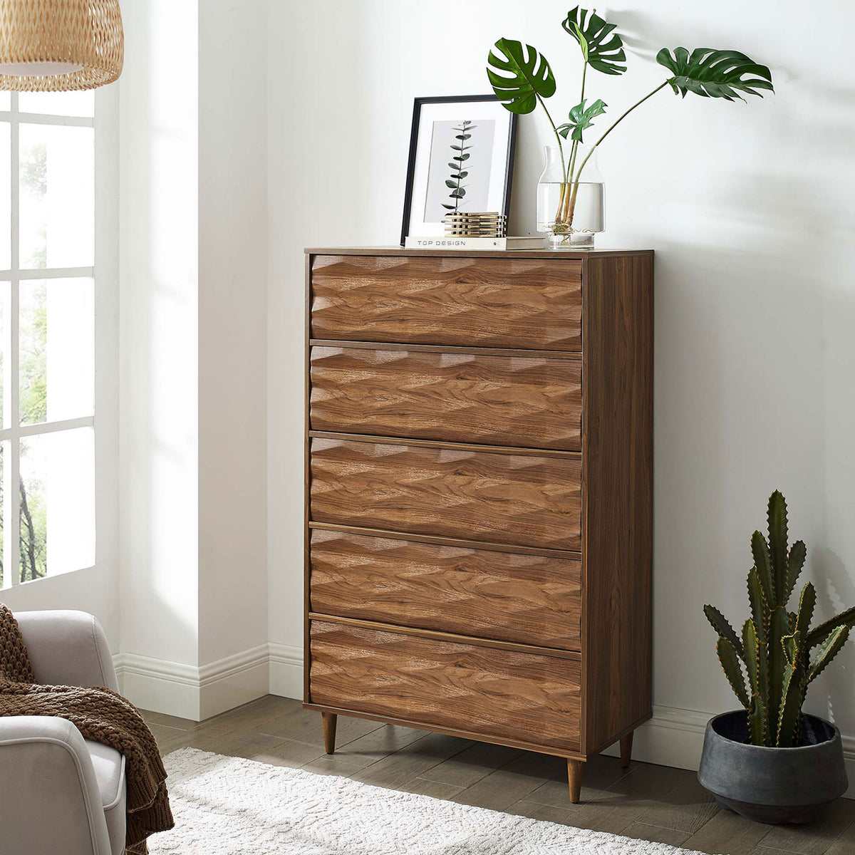 Vespera walnut chest styled with plants and decor, adding warm vertical storage to a bright modern room || MOD-7082-WAL || front_angle_room