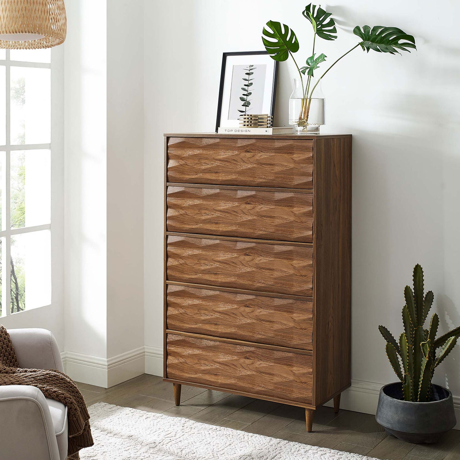 Vespera walnut chest styled with plants and decor, adding warm vertical storage to a bright modern room || MOD-7082-WAL || front_angle_room