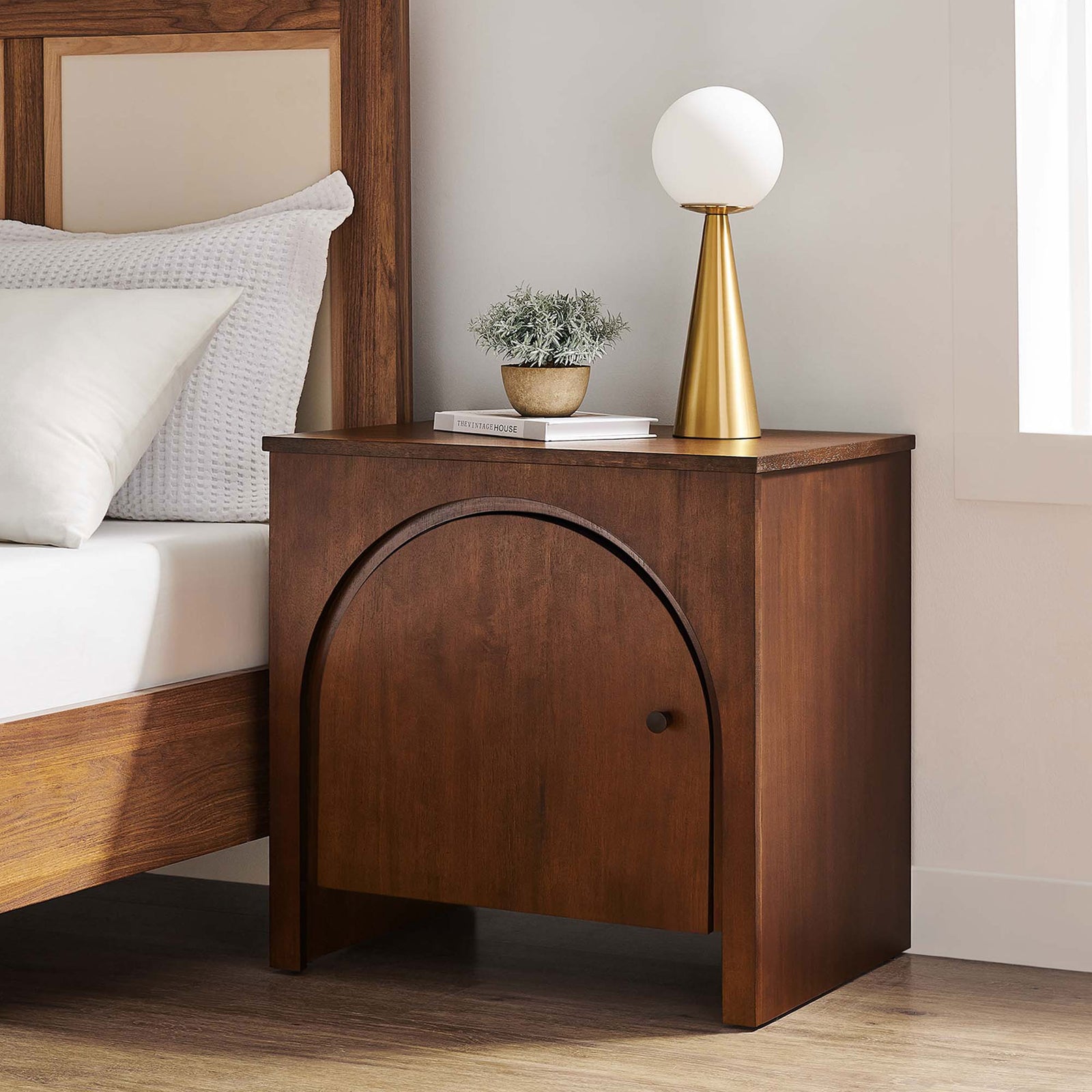 Walnut Appia arched door nightstand styled beside a modern bed with lamp and decor on the tabletop || MOD-7109-WAL || front_room