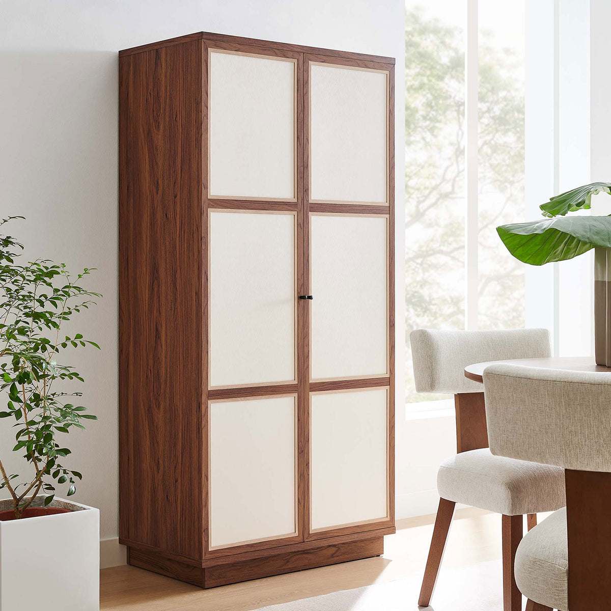 Capri wardrobe cabinet styled in a dining room, adding tall concealed storage in a modern walnut finish || MOD-7156-WAL || front_angle_room