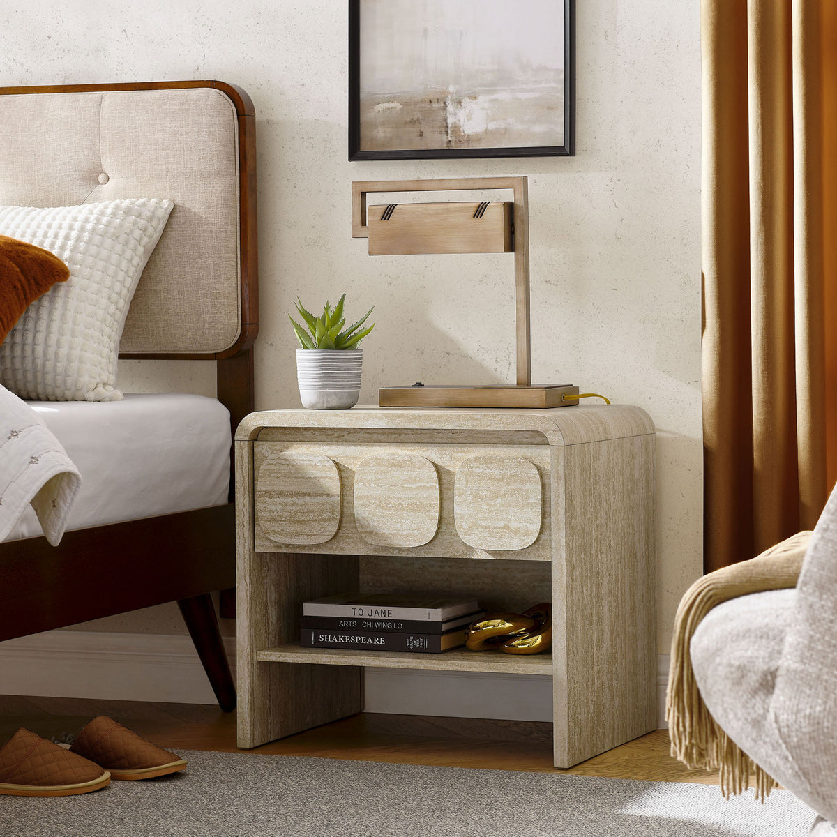 Travertine-look nightstand styled in a warm mid-century bedroom, showcasing its open shelf and display-ready top. || MOD-7160-TRA || front_angle_room