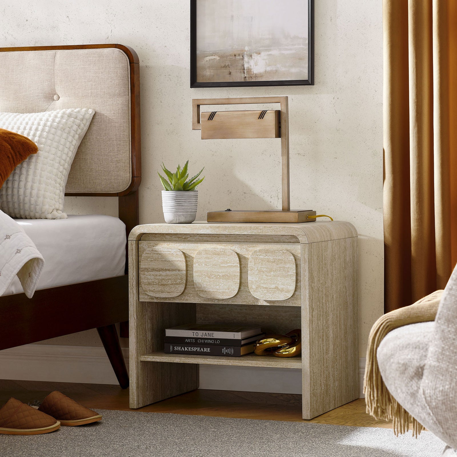Travertine-look nightstand styled in a warm mid-century bedroom, showcasing its open shelf and display-ready top. || MOD-7160-TRA || front_angle_room