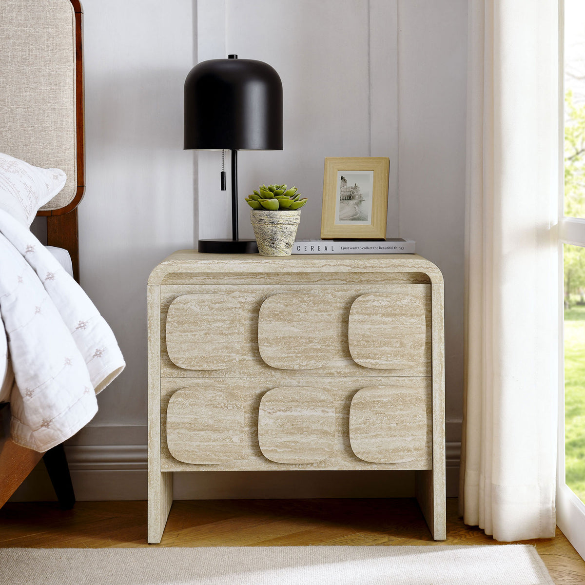Toscana travertine-look nightstand styled beside a bed with lamp and decor in a bright modern bedroom || MOD-7161-TRA || front_room