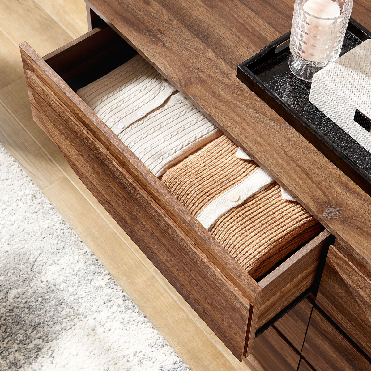 Walnut dresser drawer neatly organized with folded knits and styled bedroom decor accents || MOD-7163-WAL || storage_open_room