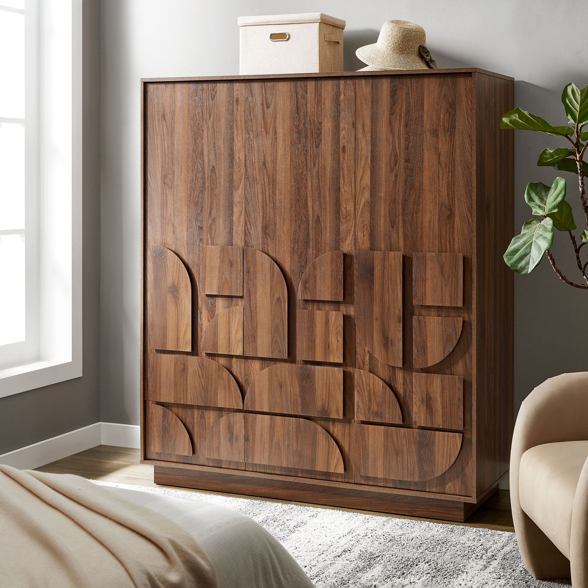 Walnut wardrobe closet styled in a modern bedroom, bringing warm texture and sculptural detail to the space. || MOD-7164-WAL || front_angle_room