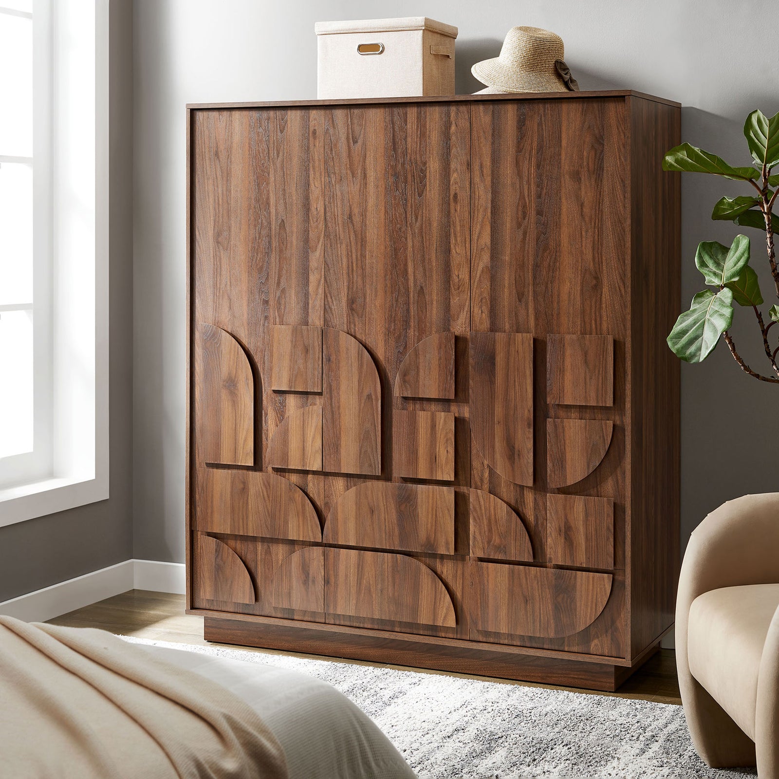 Walnut wardrobe closet styled in a modern bedroom, bringing warm texture and sculptural detail to the space. || MOD-7164-WAL || front_angle_room