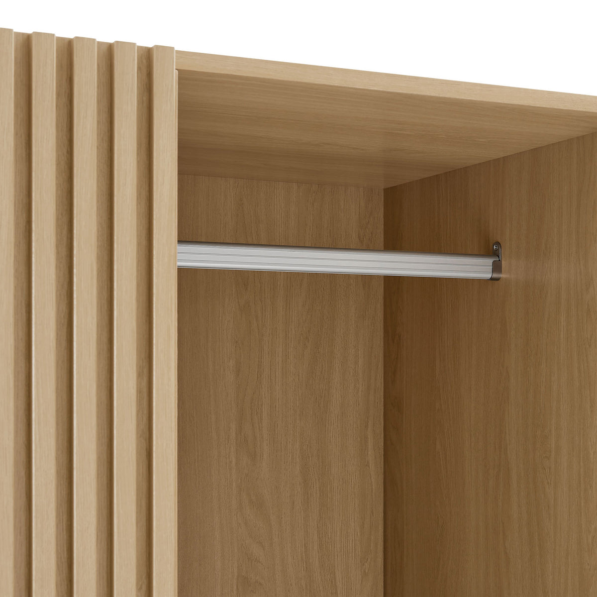 Detail of oak wardrobe interior with metal hanging rod and wood grain finish || MOD-7182-OAK || detail_studio