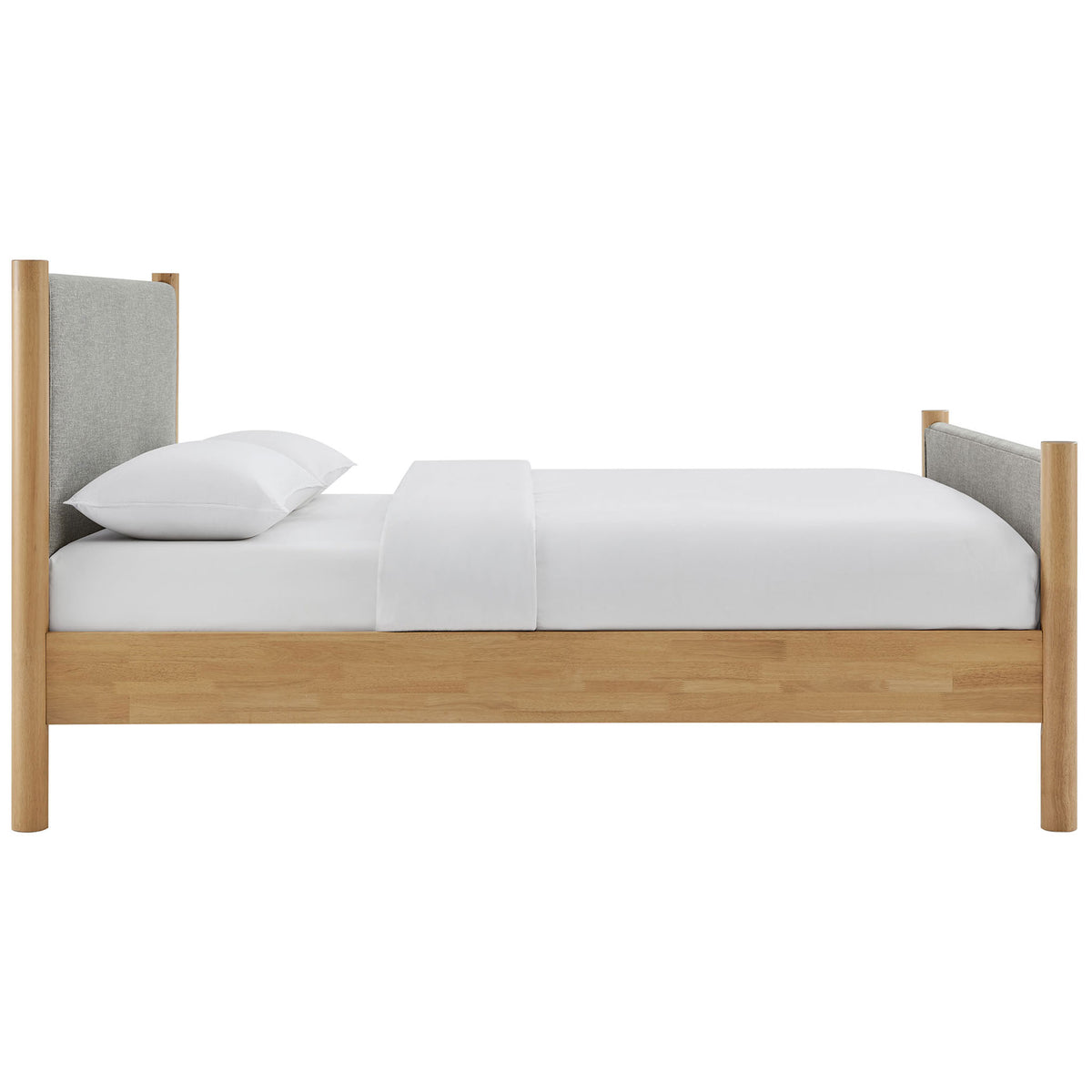 Streamlined silhouette with upholstered panels, solid oak rails, and a mid-height footboard || MOD-7189-HEW-OAK || side_studio
