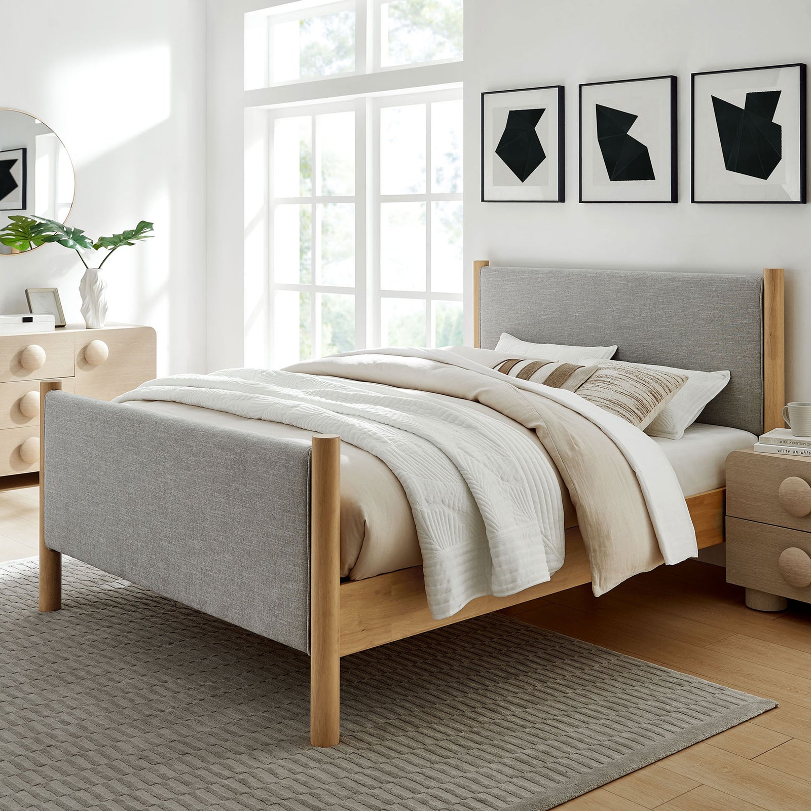Minimalist bed anchors a bright bedroom with gray upholstery, wheat oak posts, and layered neutral bedding || MOD-7189-HEW-OAK || front_angle_room