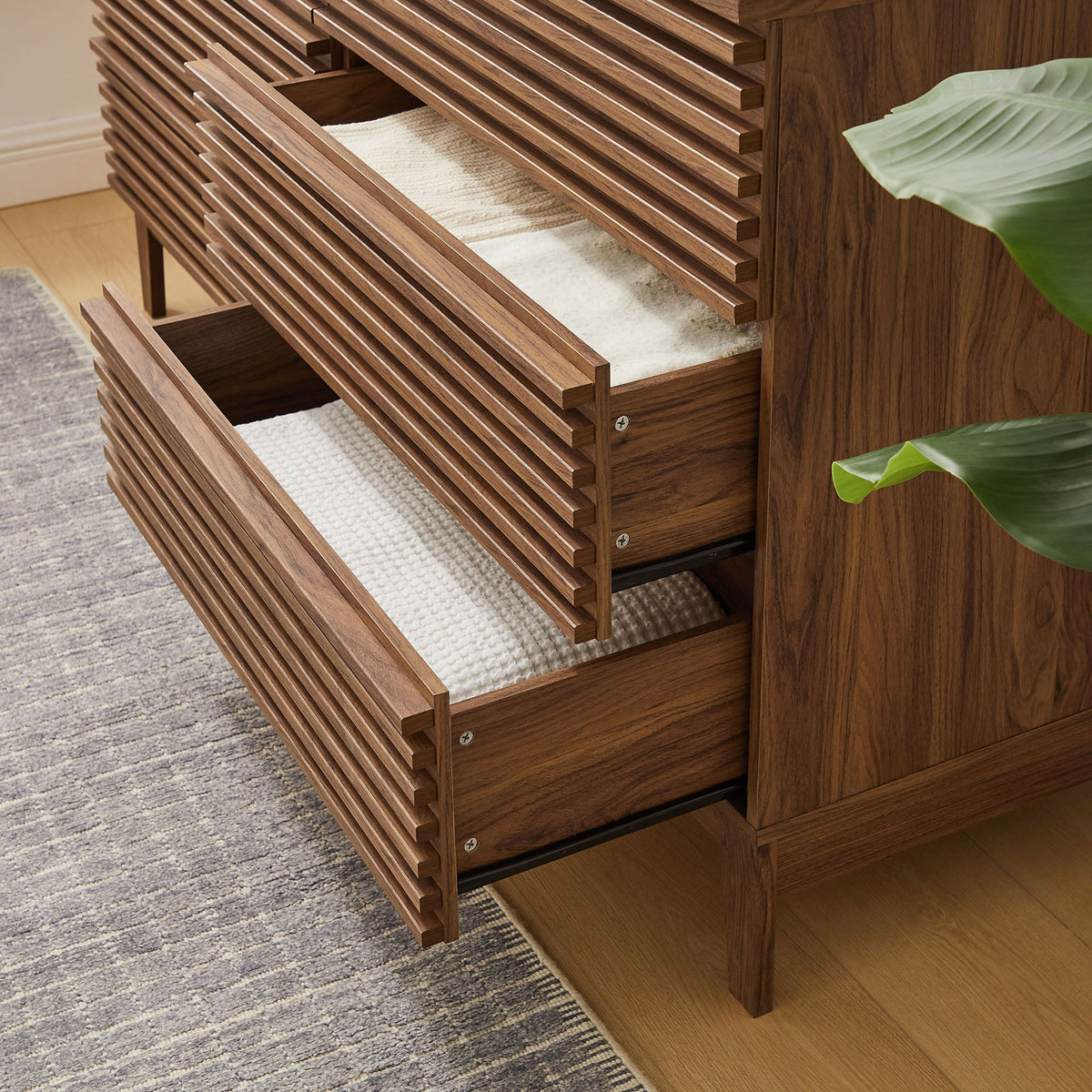 Open drawers filled with textiles emphasize everyday storage convenience in a cozy bedroom. || MOD-7200-WAL || storage_open_room