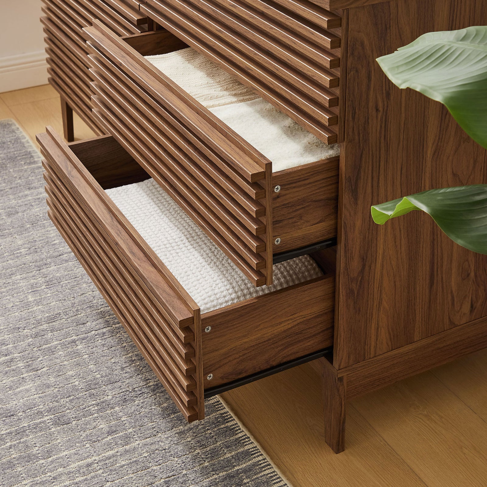 Open drawers filled with textiles emphasize everyday storage convenience in a cozy bedroom. || MOD-7200-WAL || storage_open_room
