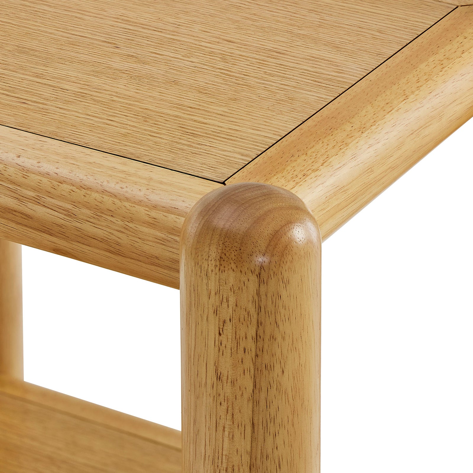 Rounded tabletop corner detail showcasing the warm oak veneer finish and seamless leg joint. || MOD-7226-OAK || detail_studio