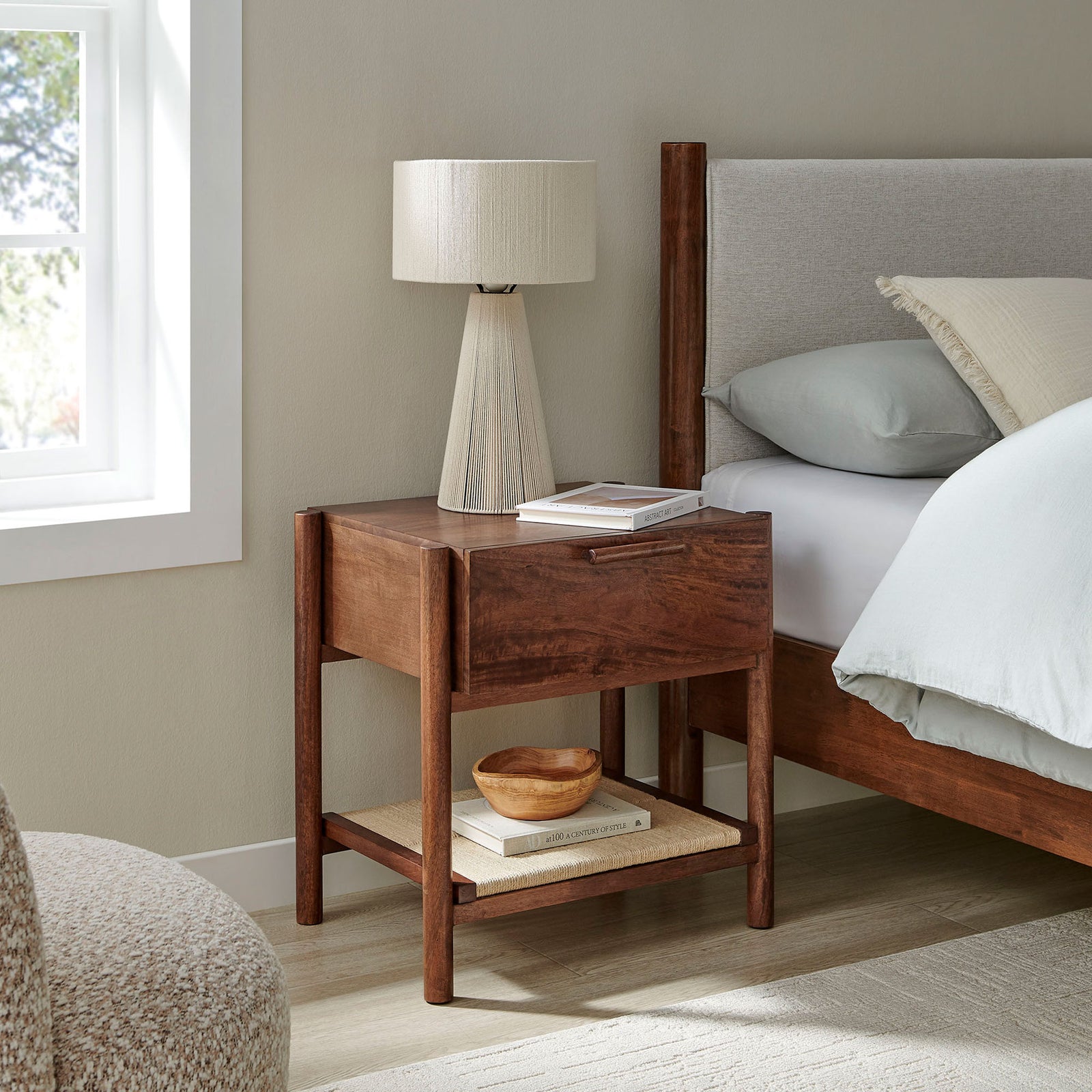 Oswin walnut nightstand styled beside the bed with lamp and decor for a cozy modern retreat. || MOD-7227-WAL || front_angle_room