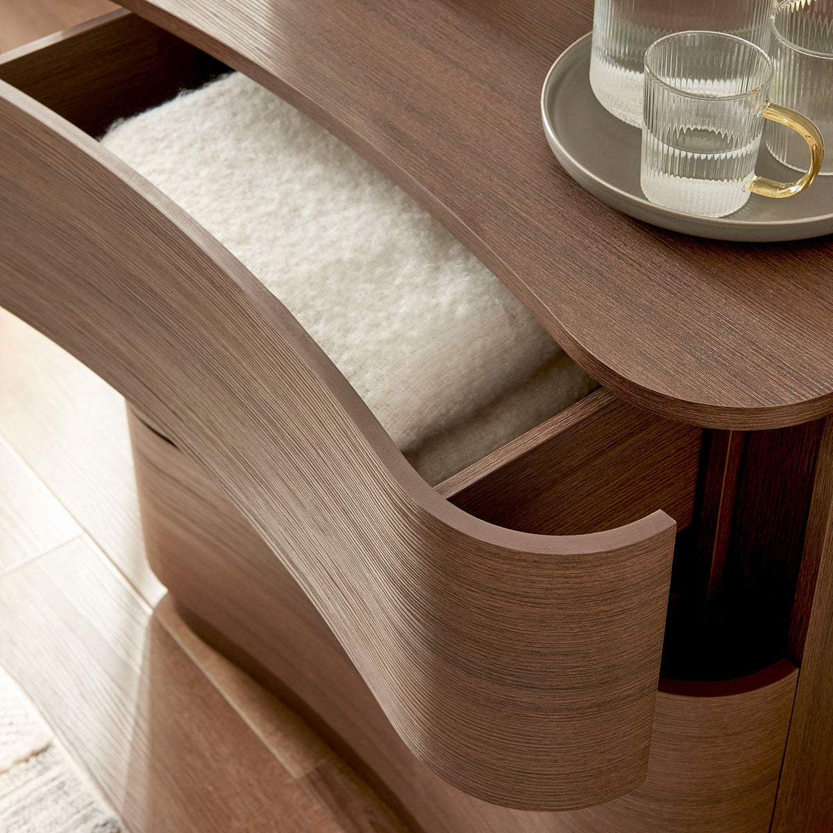 Drawer filled with soft textiles showing everyday storage use and rich brown oak texture || MOD-7230-BBO || storage_open_room