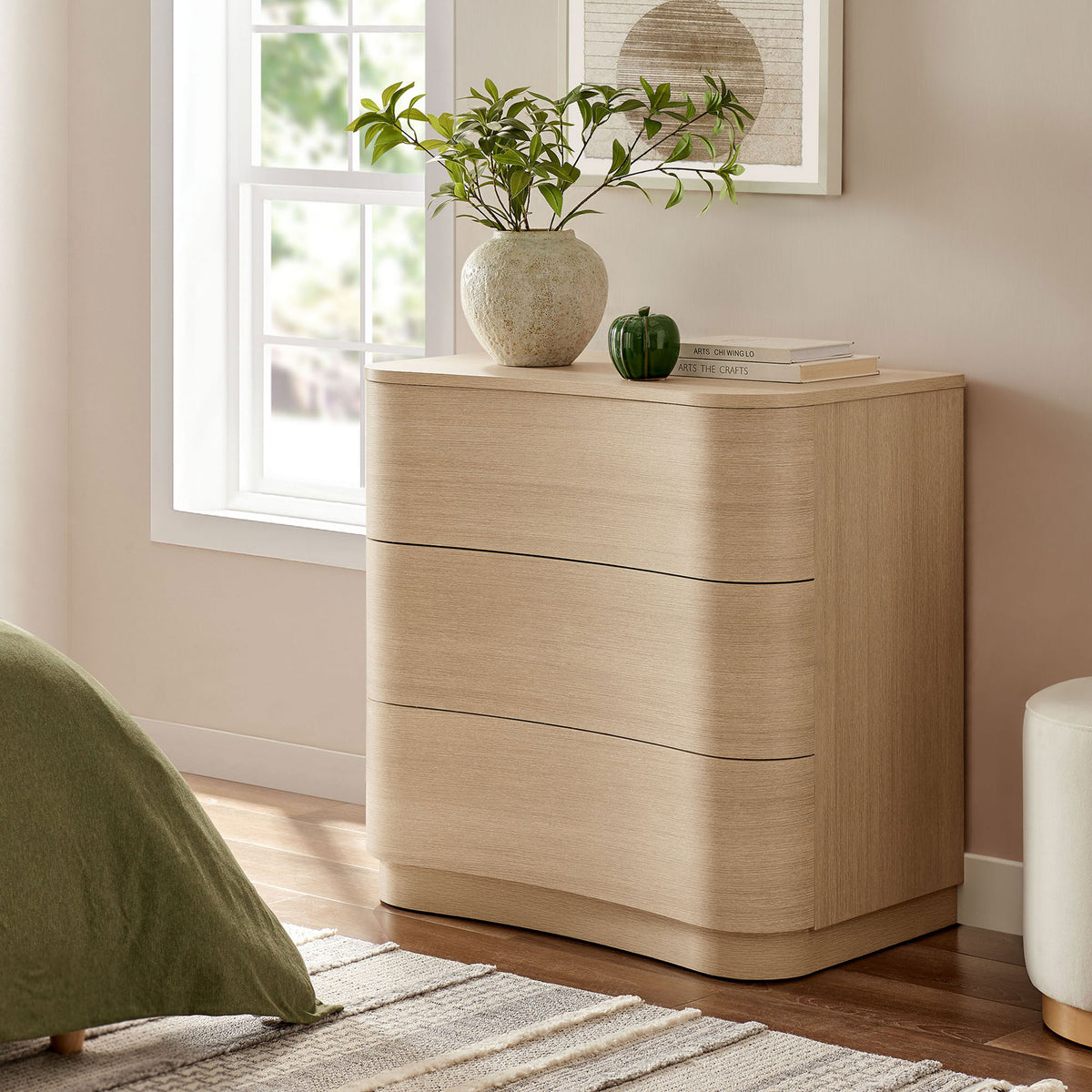 Compact Mirae dresser in brushed light oak styled with decor, bringing soft curves to a bright bedroom || MOD-7230-BOA || front_angle_room