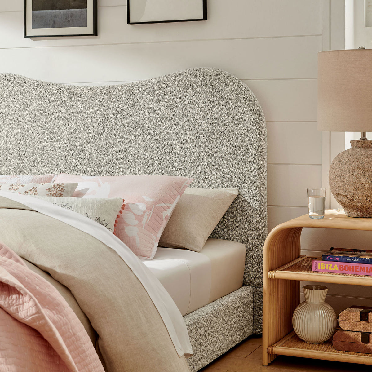 Boucle headboard and clean lines add warmth beside natural wood accents in a bright bedroom || MOD-7233-RIV || detail_room