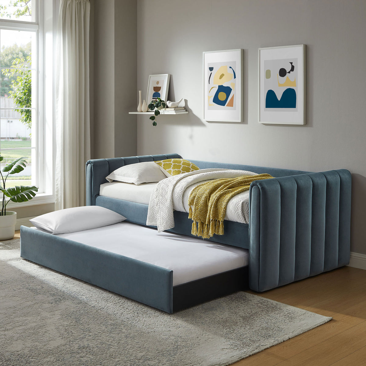 Daybed with pull-out trundle extended, offering extra sleep space in soft cadet blue velvet || MOD-7234-CAB || front_angle_open_room