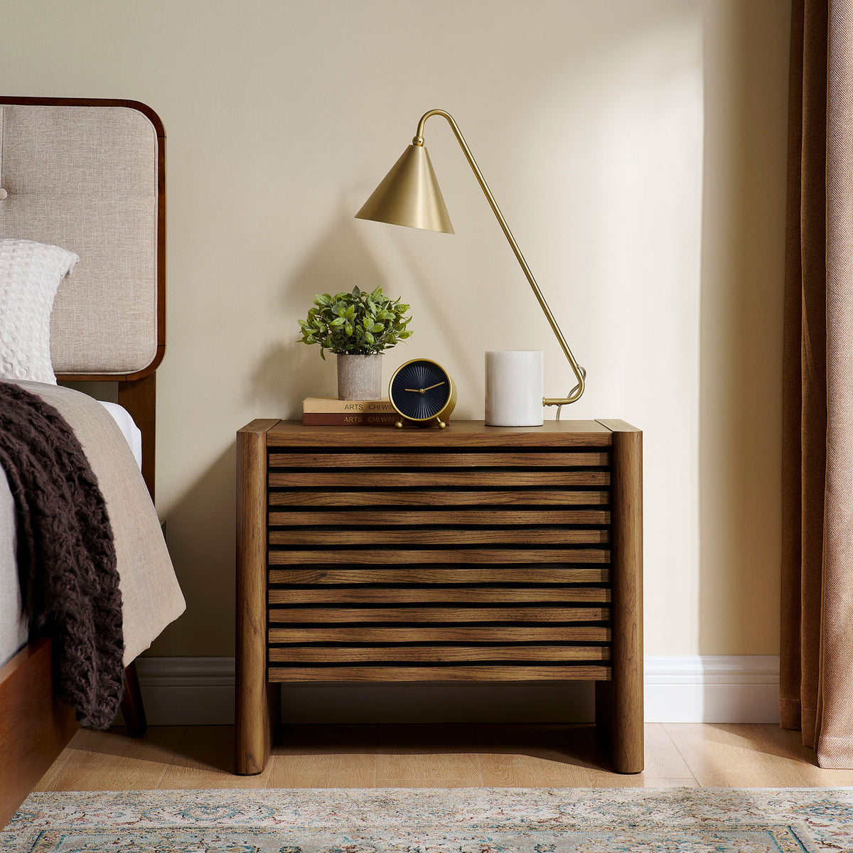 Walnut wave nightstand adding warm modern texture beside the bed in a cozy bedroom setting. || MOD-7236-WAL || front_room
