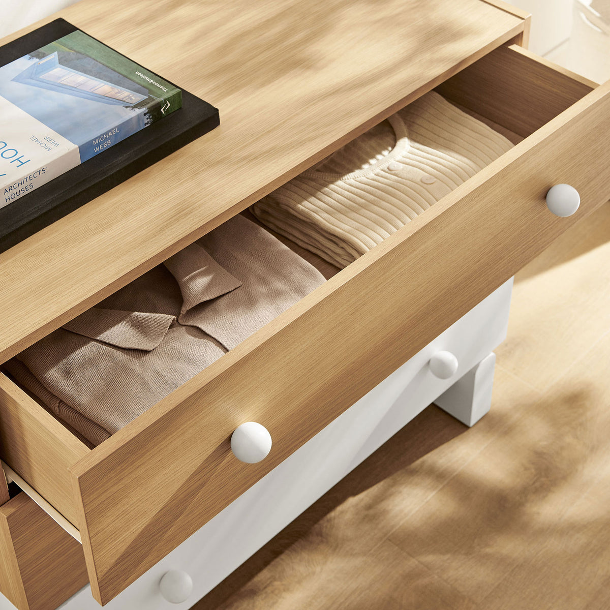 Top drawer of compact dresser neatly storing folded clothes and everyday essentials || MOD-7239-OAK-WHI || storage_open_room