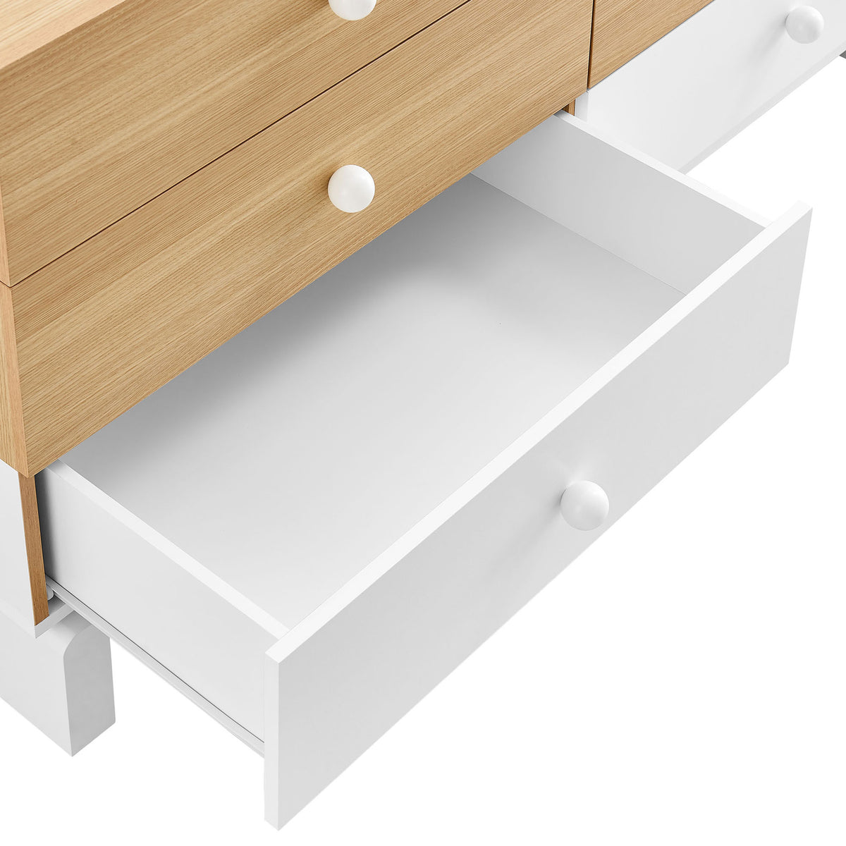 White lower drawer pulled out to reveal deep storage space and round knob handle detail || MOD-7241-OAK-WHI || storage_open_studio