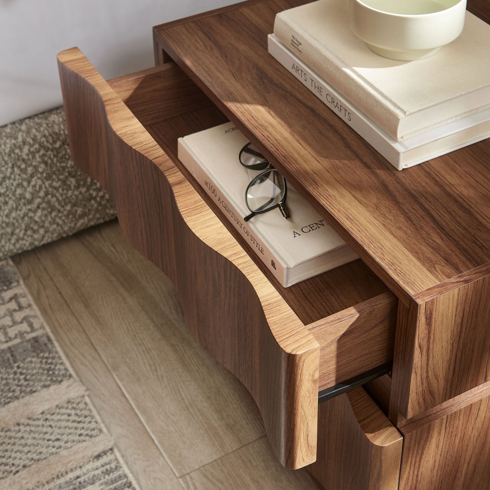 Open drawer neatly stores books and glasses on this walnut nightstand beside the bed || MOD-7243-WAL || storage_open_room