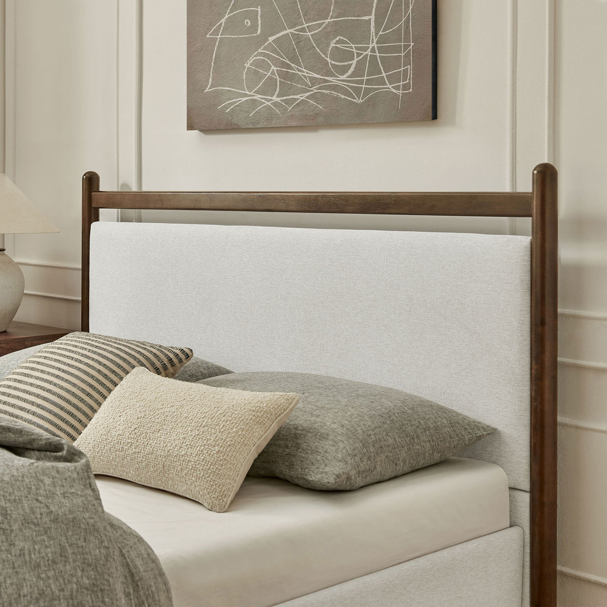 Softly textured upholstered headboard pairs with warm wood accents for a cozy, modern feel || MOD-7248-WEN-HEI || detail_room