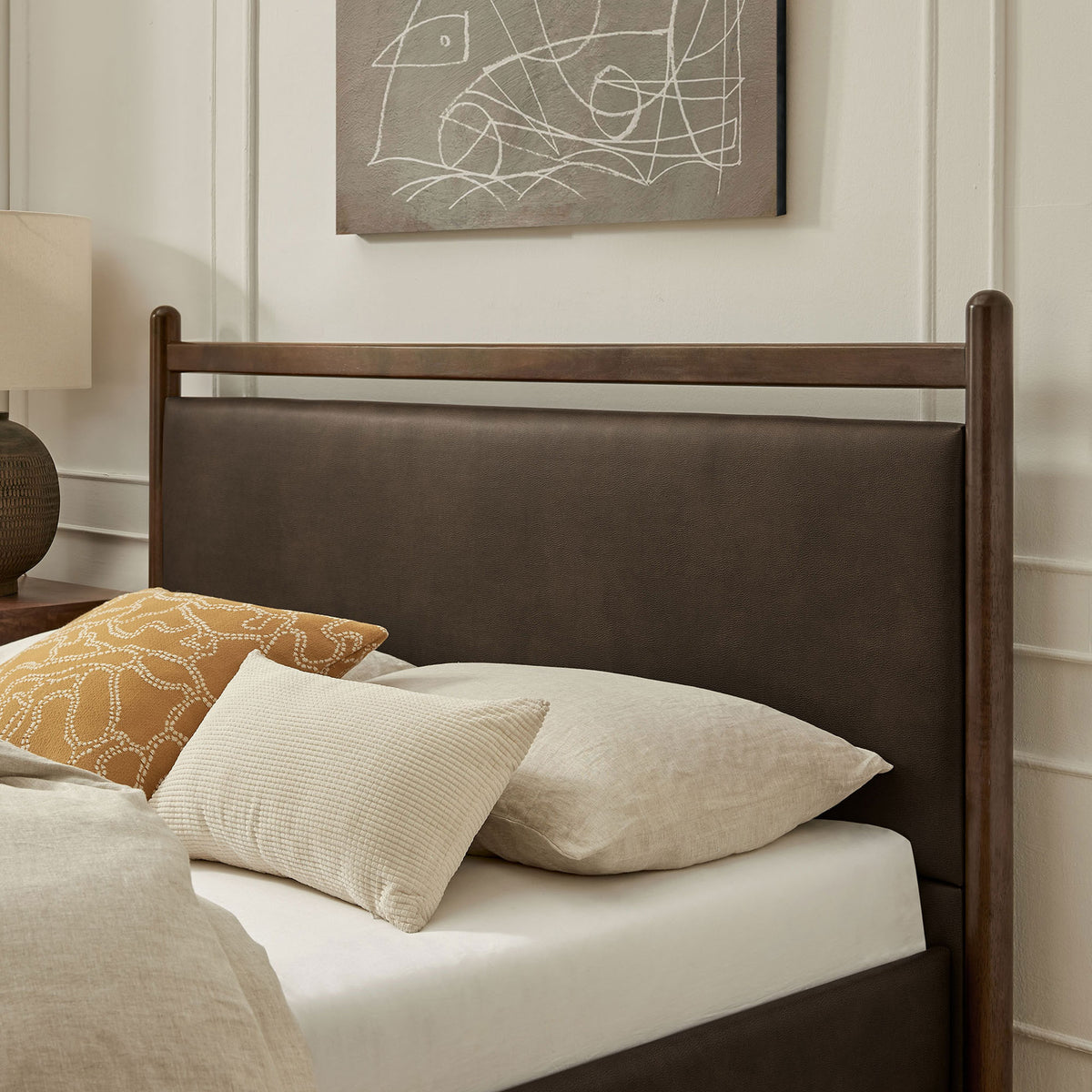 Cushioned headboard in mushroom vegan leather pairs with warm wood for inviting bedroom comfort || MOD-7249-WEN-MUS || detail_room
