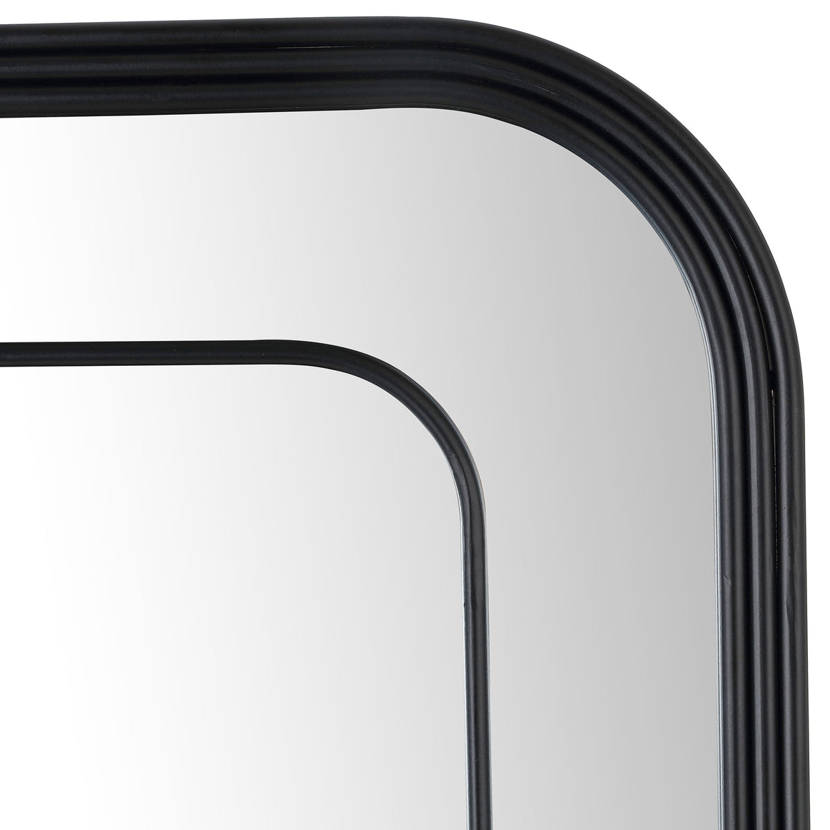 Softly rounded corners and layered black rails give the mirror a sculptural, open frame. || MRR1049A || detail_studio