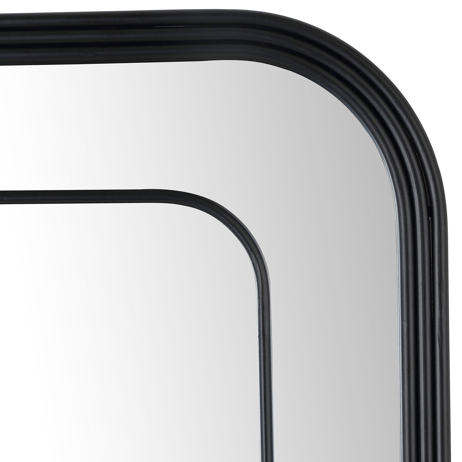 Softly rounded corners and layered black rails give the mirror a sculptural, open frame. || MRR1049A || detail_studio