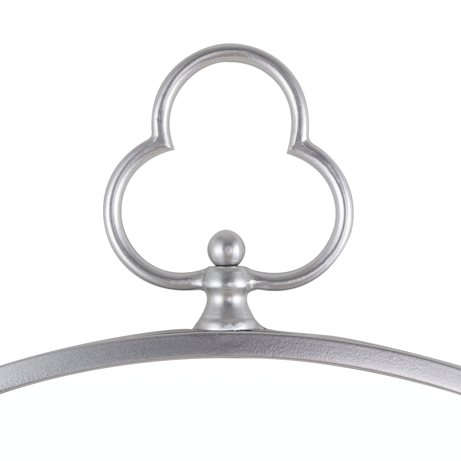 A sculpted silver trefoil ornament crowns the mirror's slender, textured frame || MRR1050A || detail_studio
