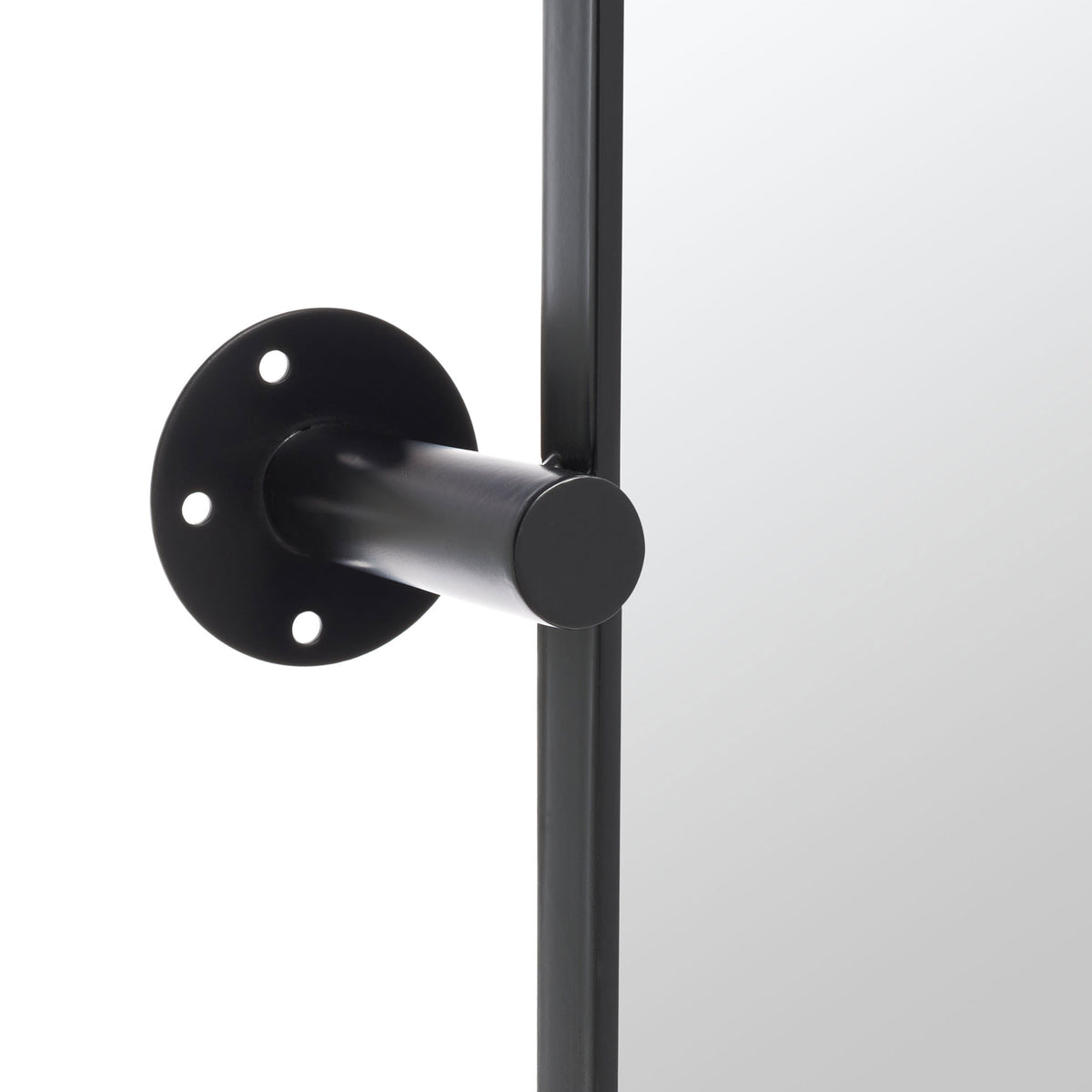 A black metal mounting arm links the mirror frame to a circular wall plate. || MRR2001A || detail_studio