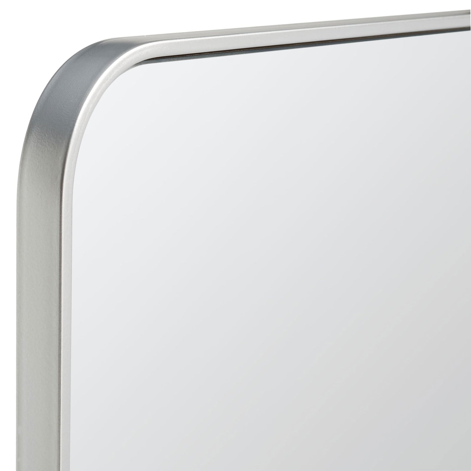 A curved silver metal frame traces the upper corner of the reflective glass. || MRR2001B || detail_studio
