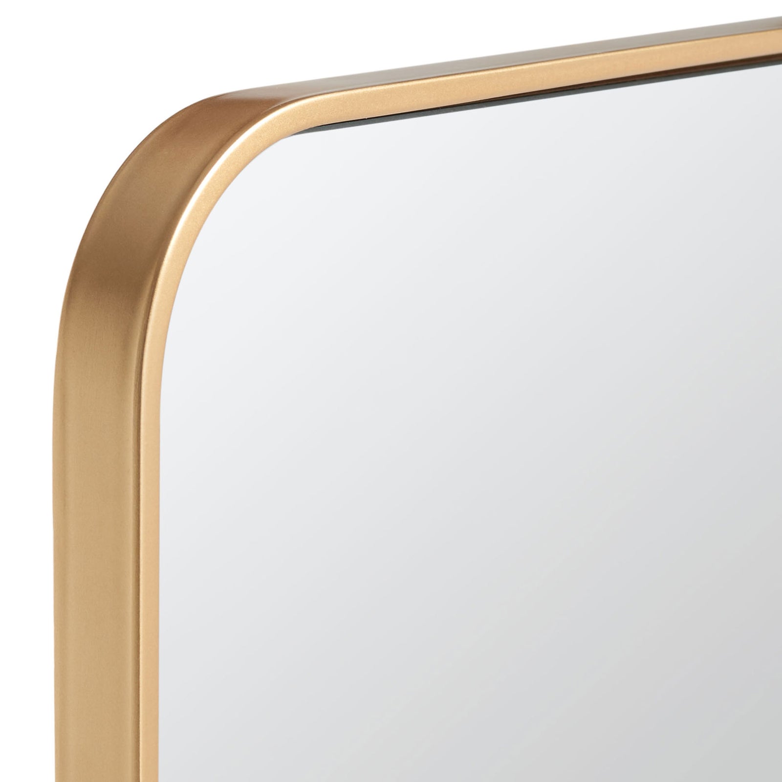 A softly rounded corner pairs reflective glass with a slim brass-finished metal frame. || MRR2001C || detail_studio