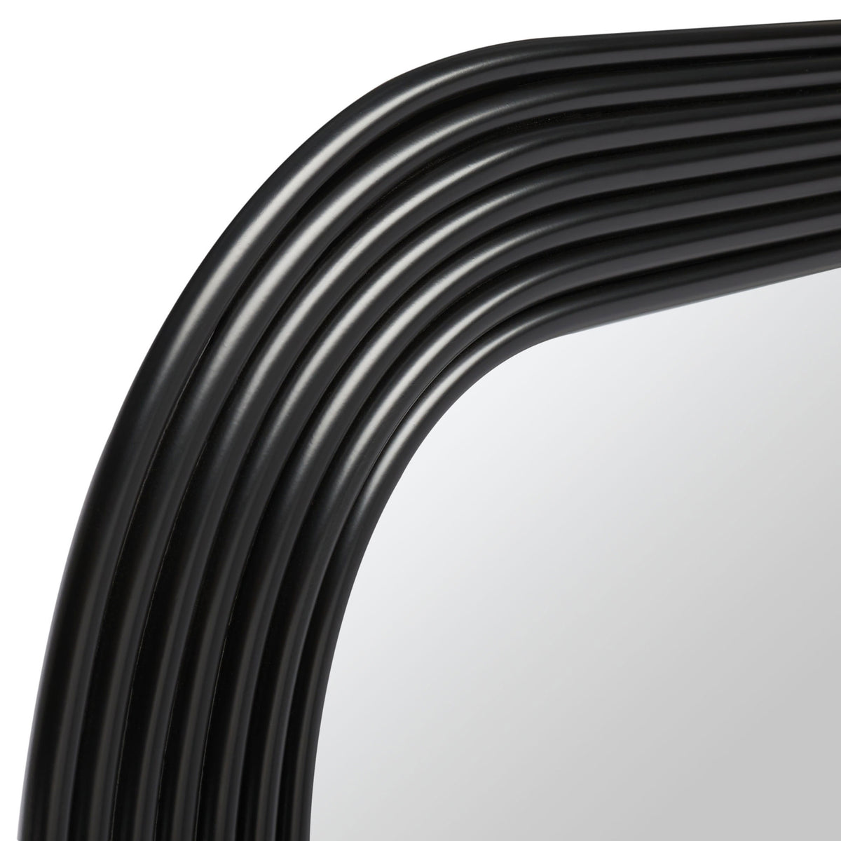Layered black metal ridges curve around the mirror's rounded corner