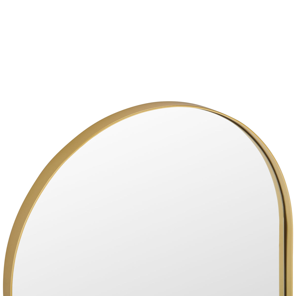 A warm brass-finished frame traces the mirror's rounded top with a metallic sheen.
