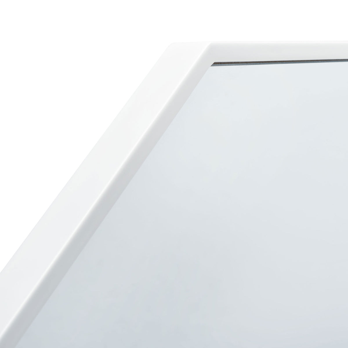 Smooth white metal edging gives the mirror a clean, angled outline || MRR2010C || detail_studio