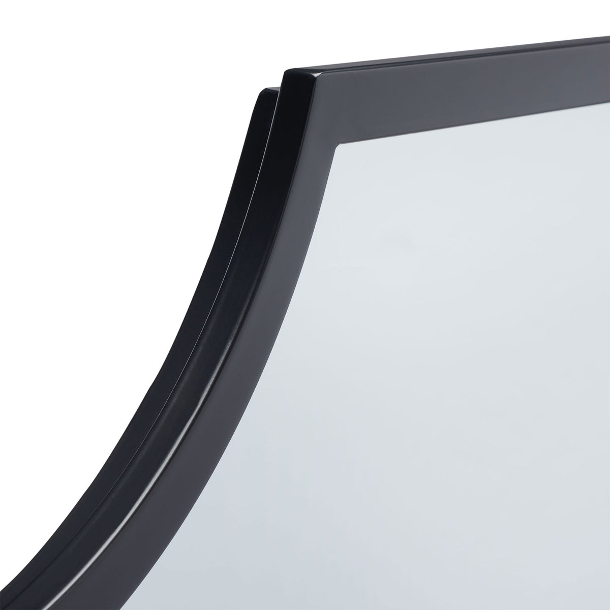 A smooth black metal frame follows the mirror's sculpted curved edge.