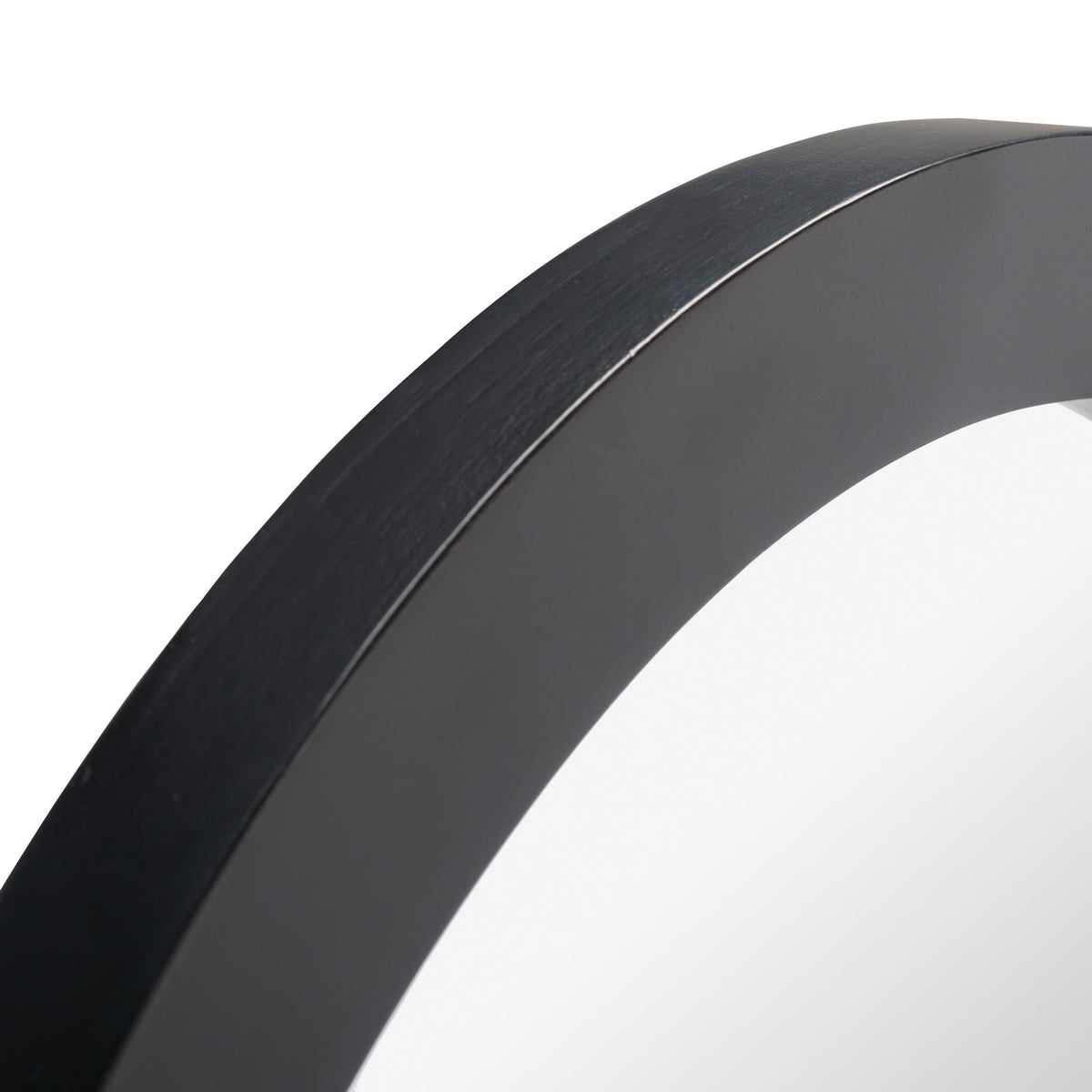 A smooth black wood frame curves around the mirror glass for a sleek, understated finish. || MRR2015A || detail_studio