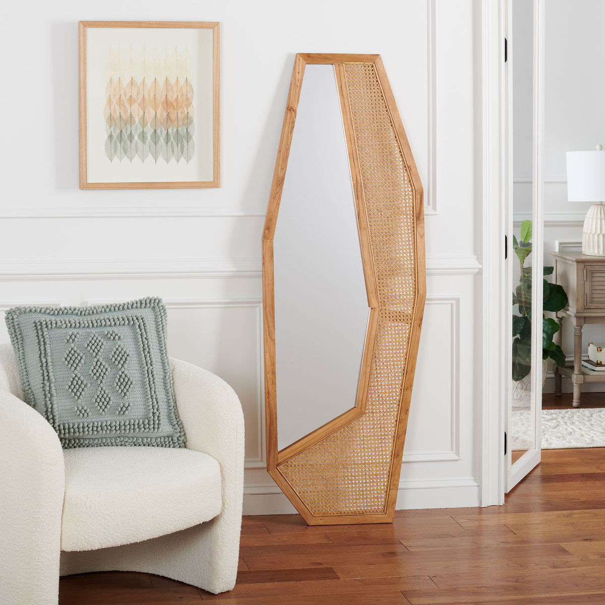 Warm wood grain and an airy woven panel bring organic texture to this tall mirror. || MRR2018B || front_room